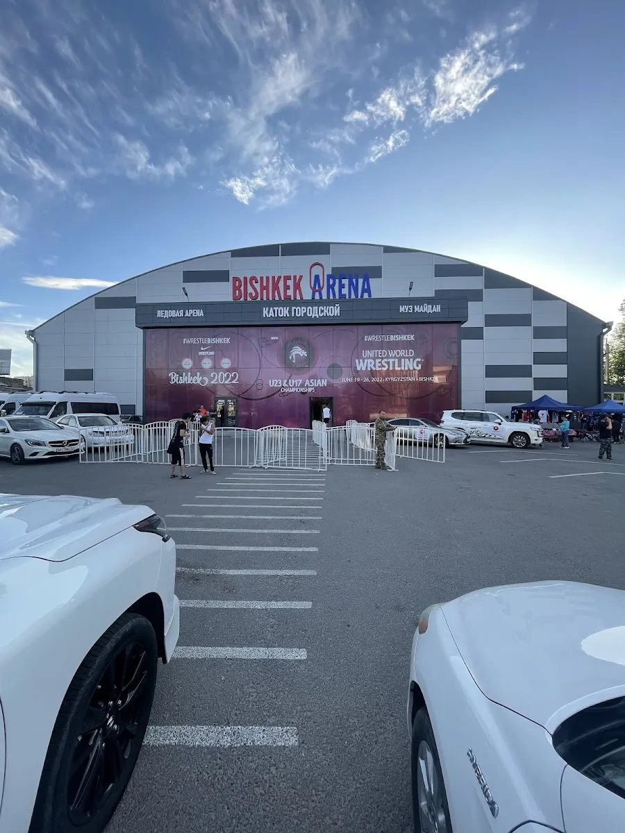 The front of the Bishkek city rink (Gorodskoy Katok, signed Bishkek Arena) with its arched hall and entrance wall — Gorodskoy Katok (Nomad Arena)