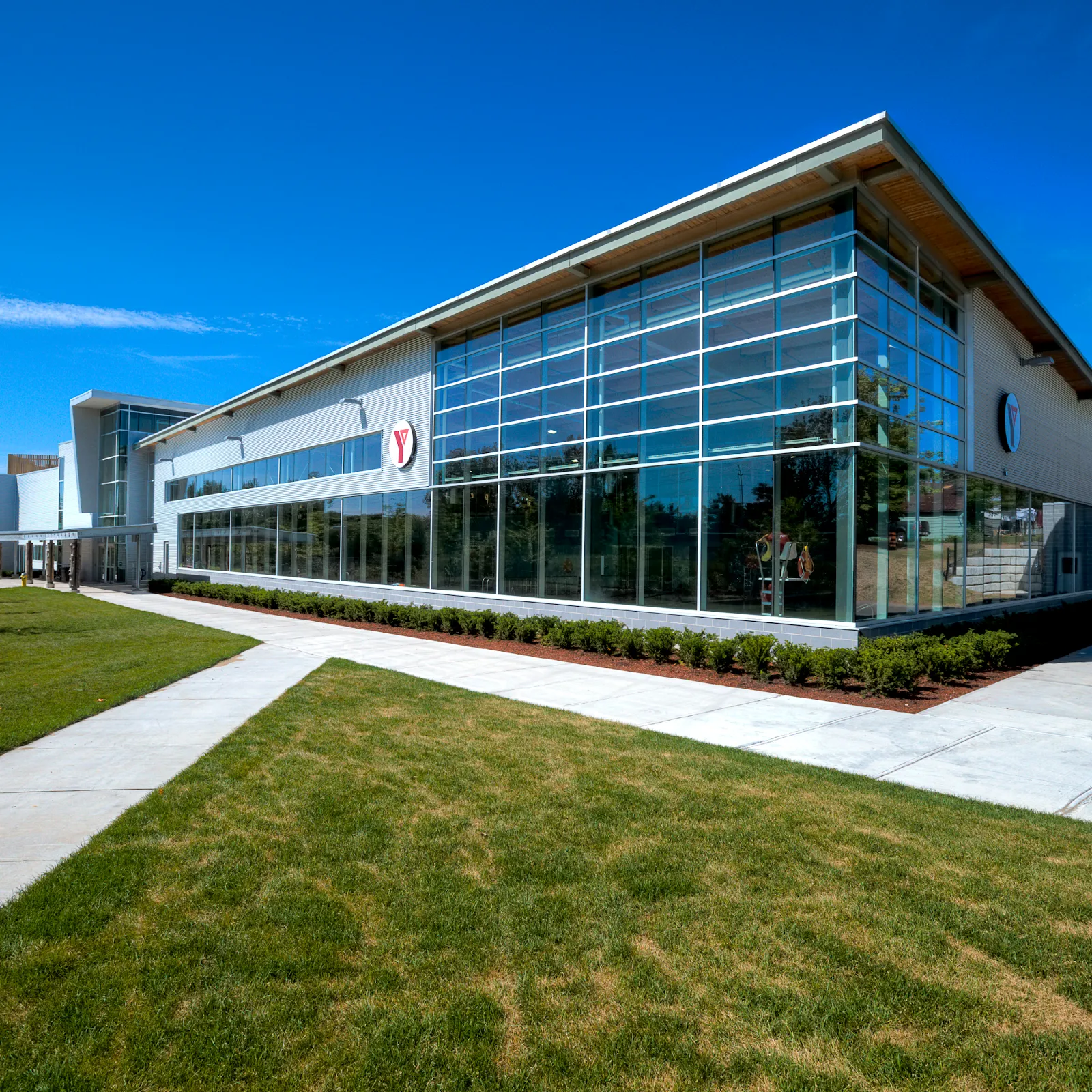 The glass-fronted Centennial Centre in Gravenhurst, the building that holds the Graeme Murray Arena, seen from the lawn on a clear day. — Graeme Murray Arena