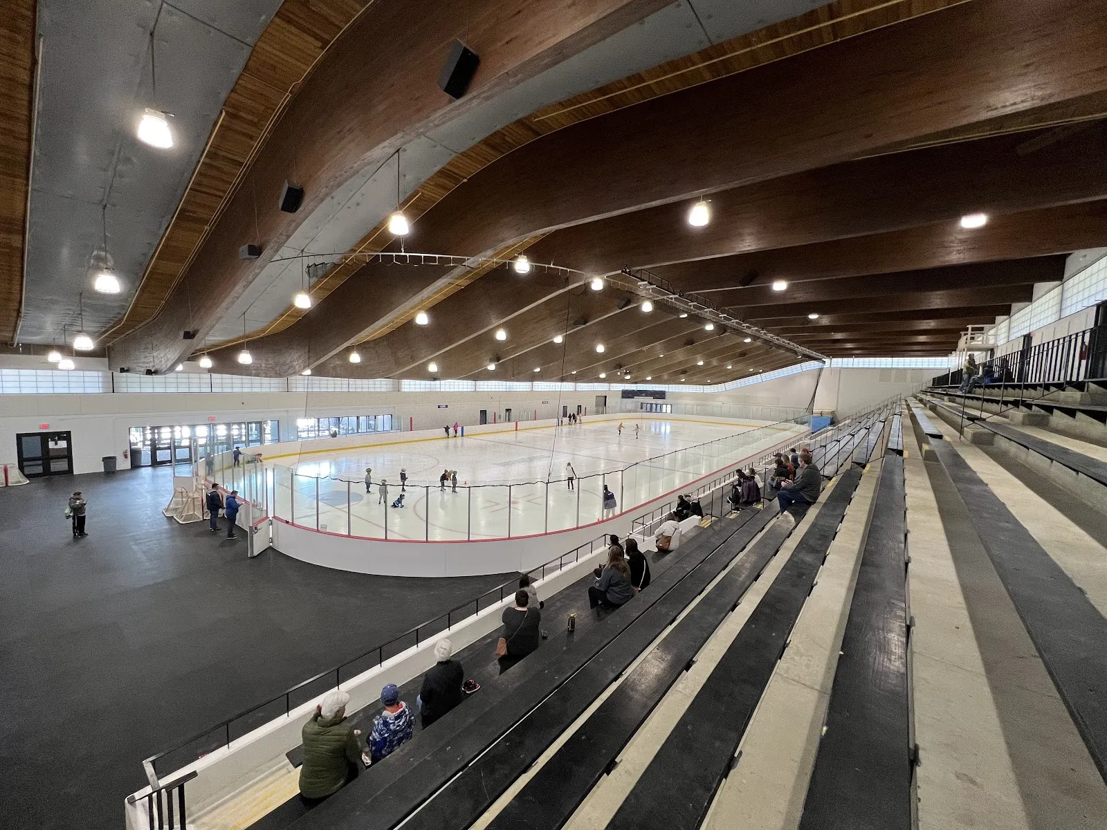 The Greensfelder arena's wood-beam roof over the rink and bleachers — Greensfelder Recreation Complex Ice Rink
