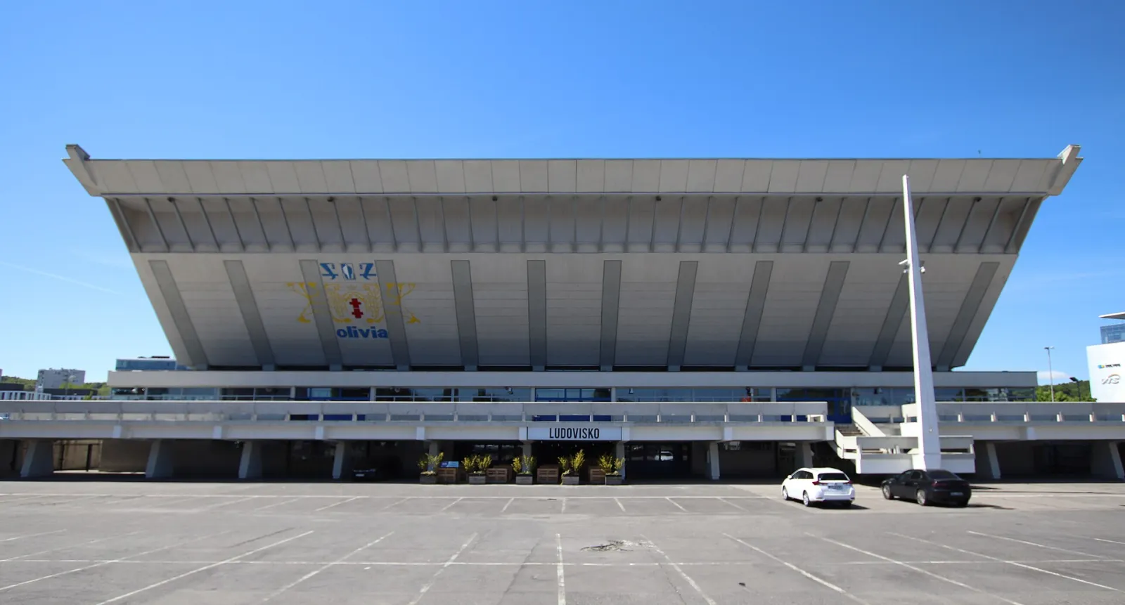 The front of Hala Olivia in Oliwa, Gdańsk, with its sloping roof — Hala Olivia