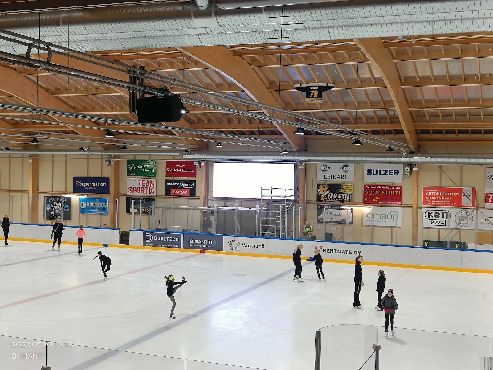 Ice and arched wooden roof of Haminan jäähalli — Haminan jäähalli