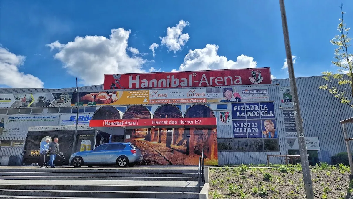 The street front of the Hannibal Arena in Herne with its red sign above the entrance. — Hannibal-Arena