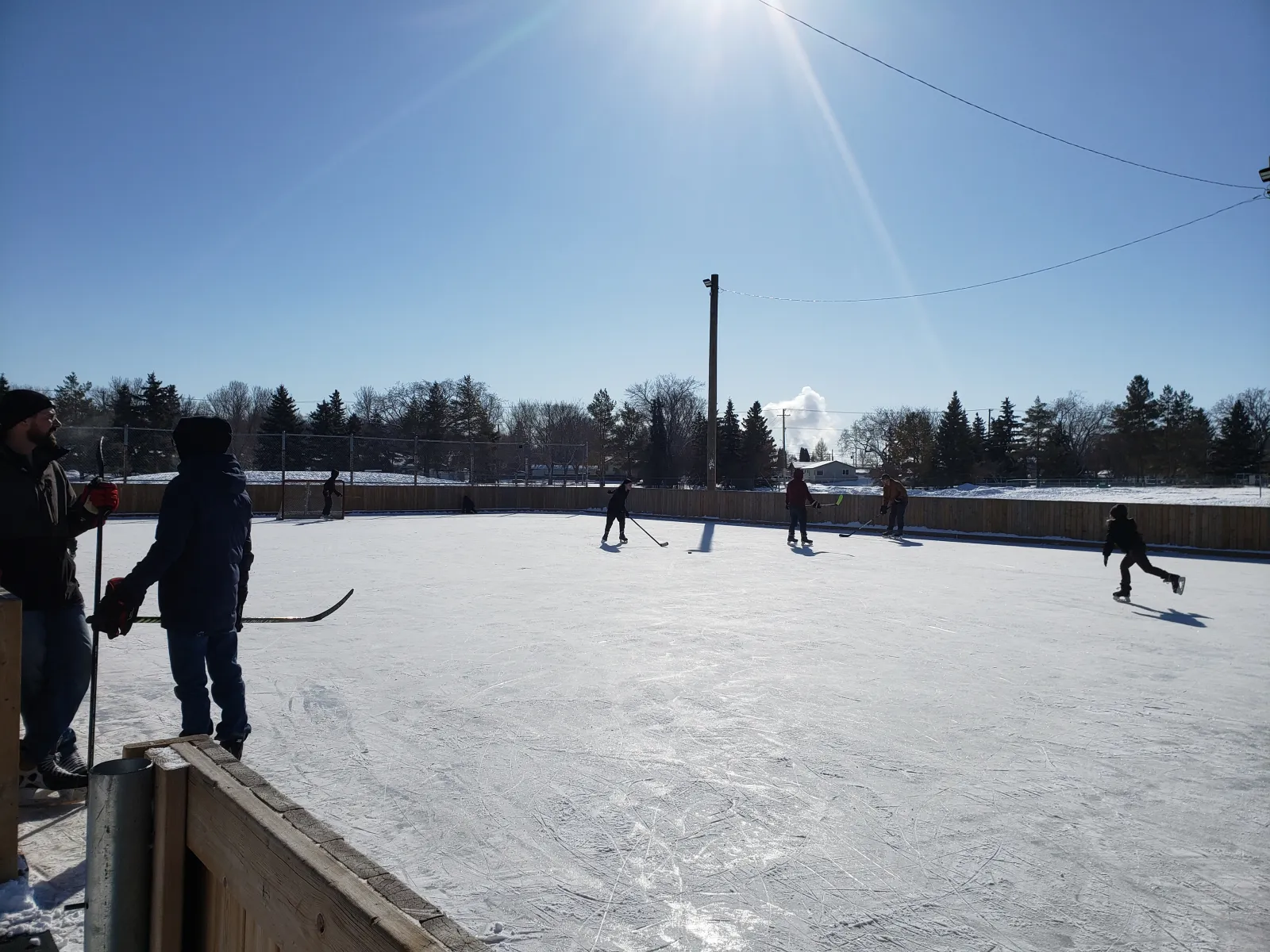 Skaters on the Henry Kelsey School rink (Hudson Bay Park / Mayfair / Kelsey Woodlawn Community Association) — Henry Kelsey School Outdoor Rink (Hudson Bay Park / Mayfair)
