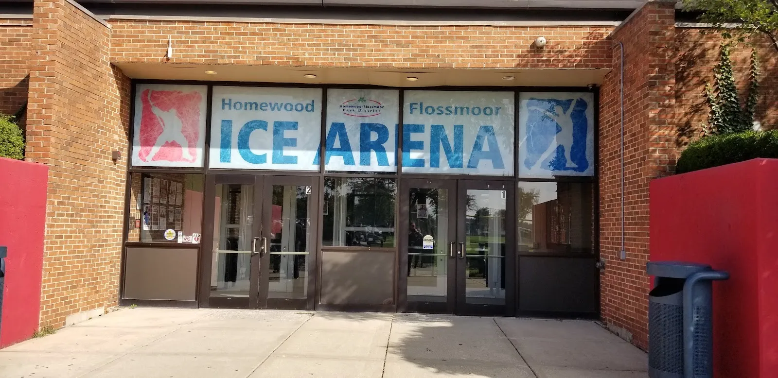 The brick entrance of the Homewood-Flossmoor Ice Arena, with the ICE ARENA banner above its glass doors — H-F Ice Arena (Flossmoor)