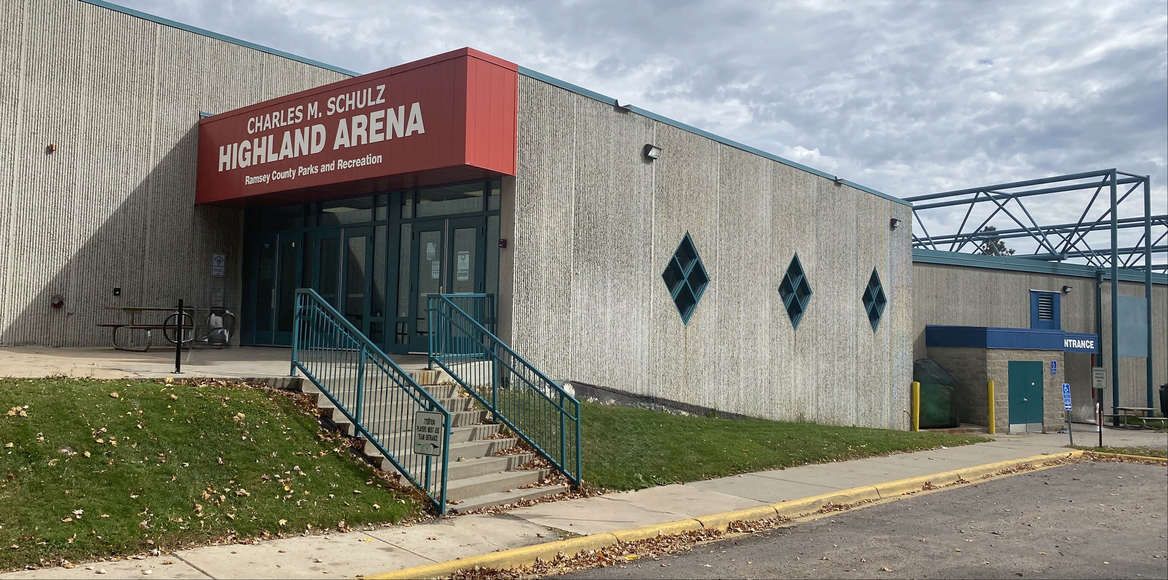 The signed Highland Arena entrance and its lower doorway. — Charles M. Schulz–Highland Arena