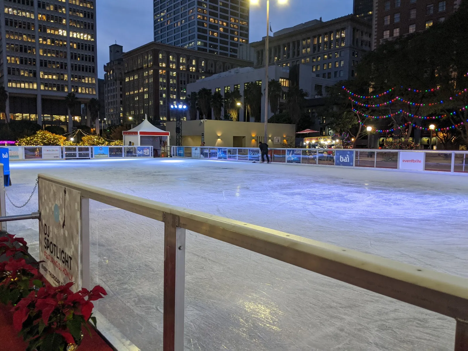 The lit ice surface of the Holiday Ice Rink at dusk (Google Maps listing photo) — Holiday Ice Rink Pershing Square