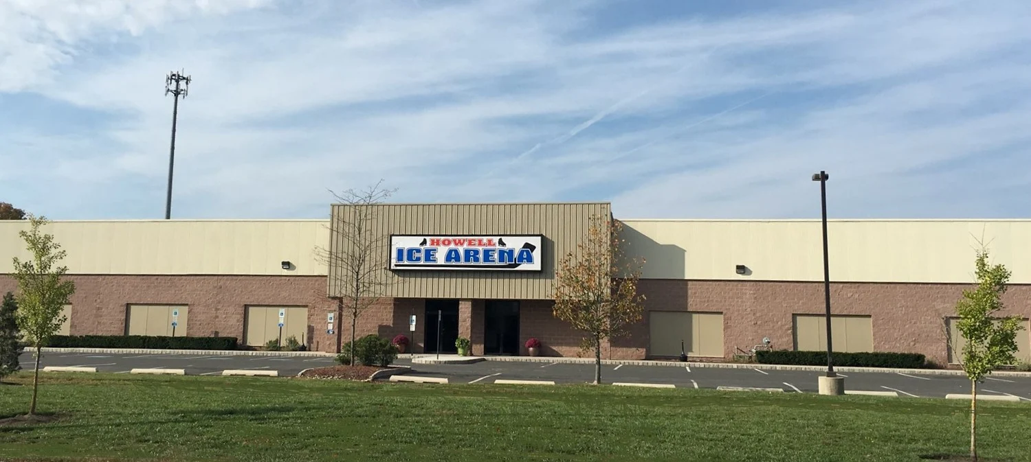 Howell Ice Arena’s main entrance, with its name clearly displayed above the doors. — Howell Ice Arena