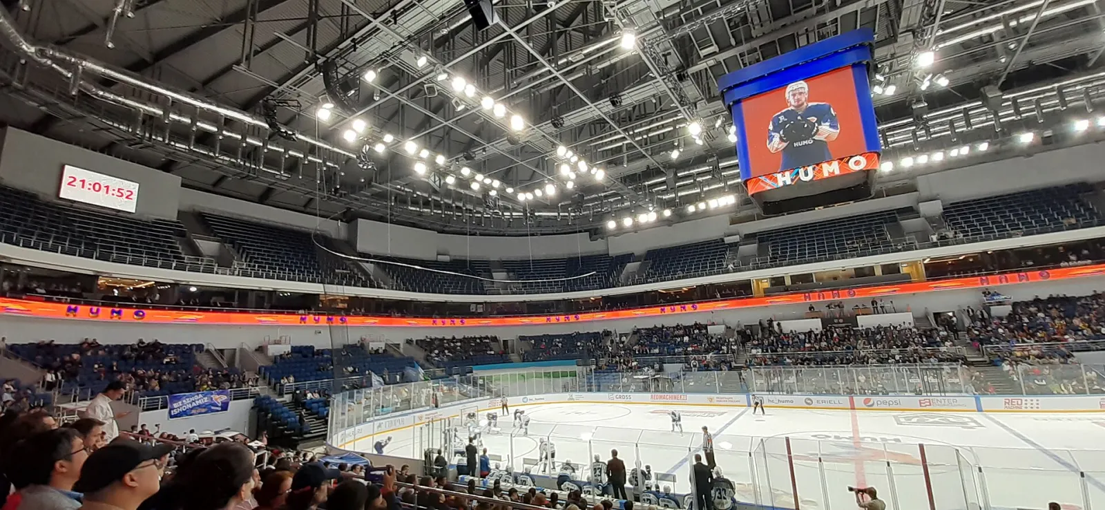 The ice in the main bowl of Humo Arena during a hockey game, seen from the stands. — Humo Arena