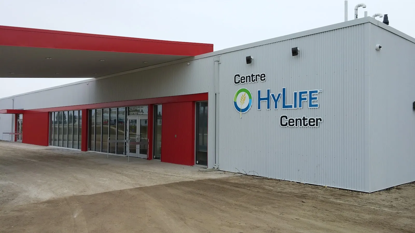 The white and red front of the HyLife Centre with its sign — HyLife Centre (La Broquerie Arena)