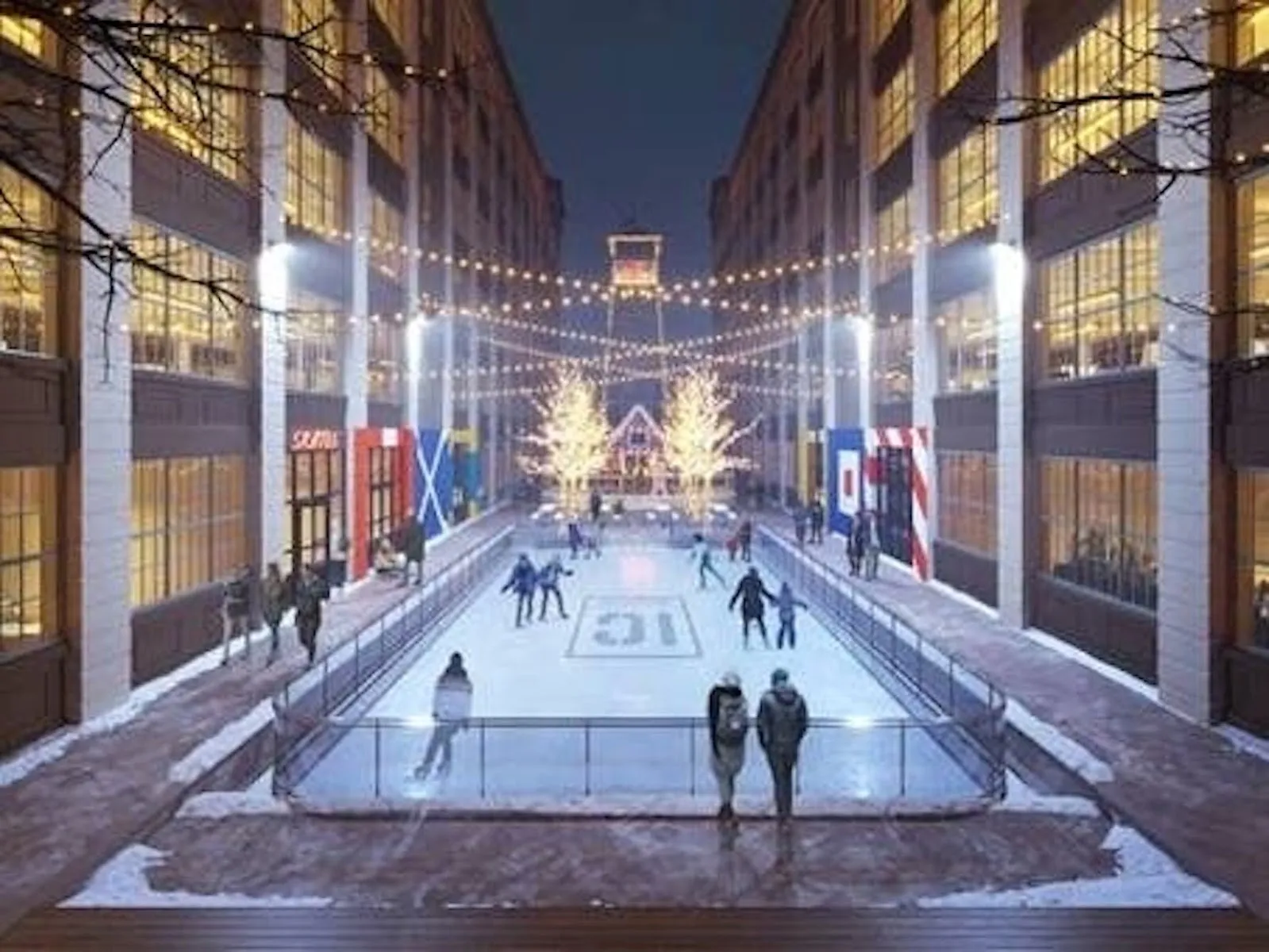 The Industry City rink laid out between two tall brick warehouse walls at dusk with the lit ice and a few skaters in the distance. — IC Ice Rink