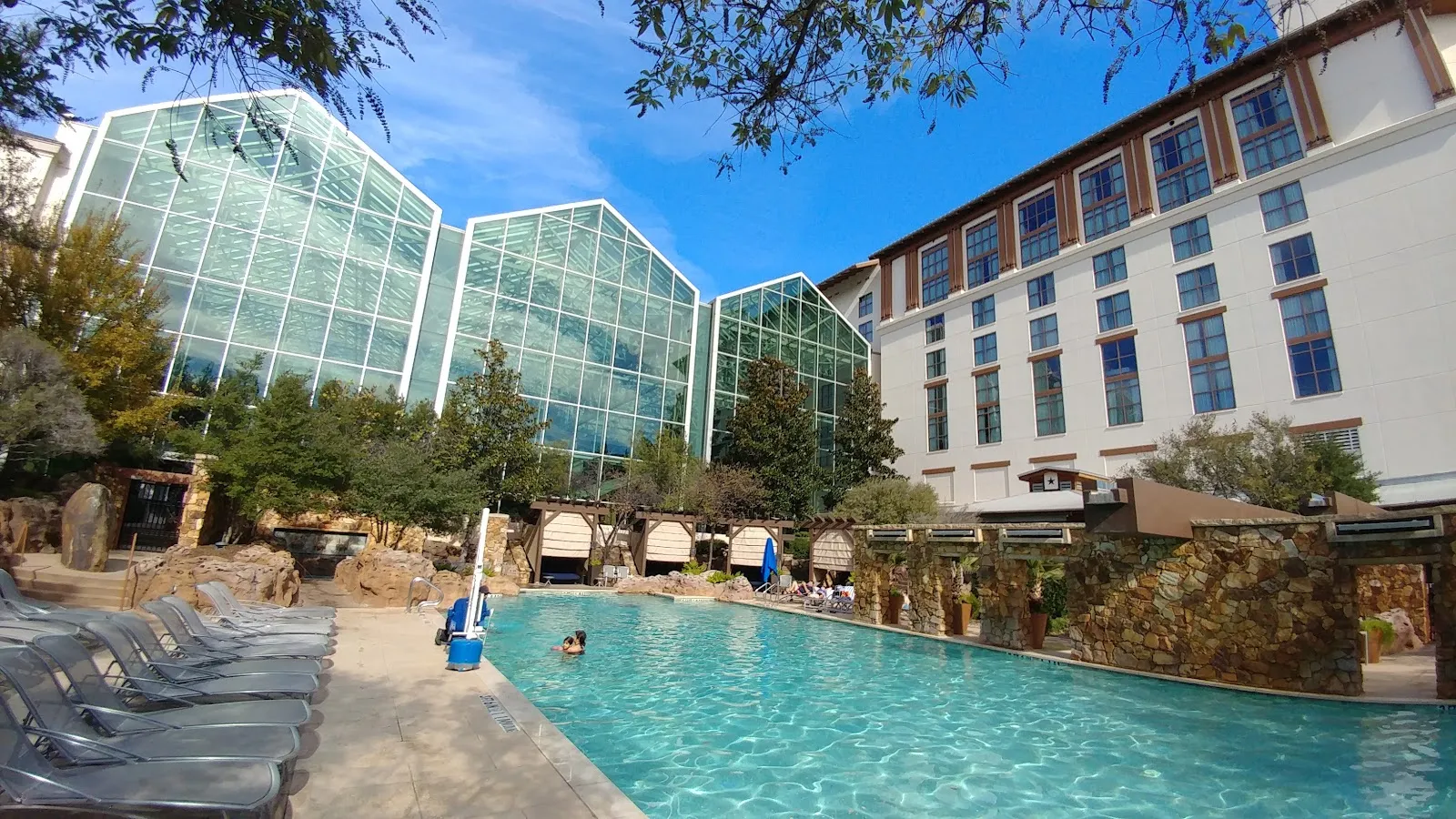 Gaylord Texan Resort's glass atrium and pool courtyard, home of the Christmas Village skating rink — Ice Skating at Gaylord Texan