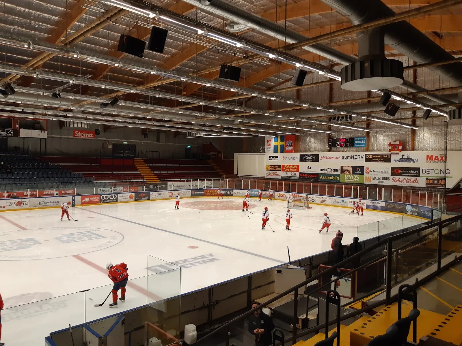 Players practising on the ice at Iskristallen Arena, Borås, seen from the stands — Iskristallen Arena