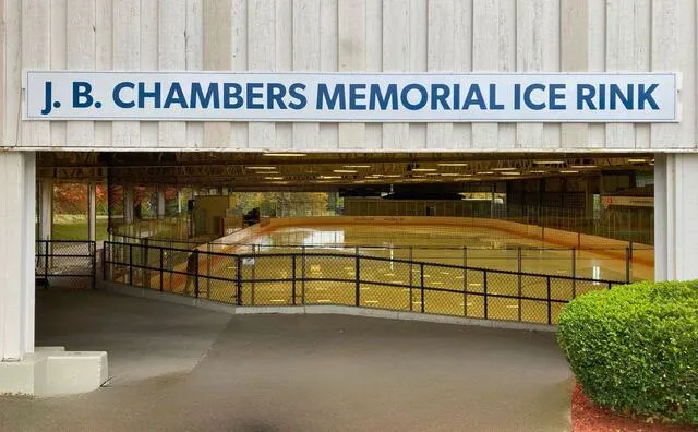 The entrance to the J. B. Chambers Memorial Ice Rink in Wheeling, with the rink name on the lintel above the covered walkway to the ice. — J.B. Chambers Memorial Rink