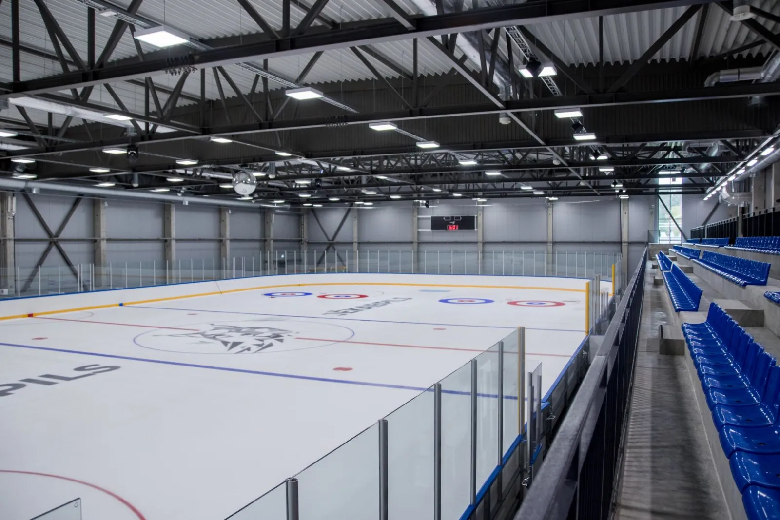 The ice sheet and stands of the Jēkabpils Sporta halle ice arena — Jēkabpils Sporta halles ledus arēna