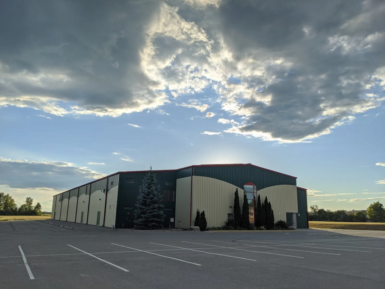 The Keeler Centre building and its parking lot under a cloudy sky — Keeler Centre Arena