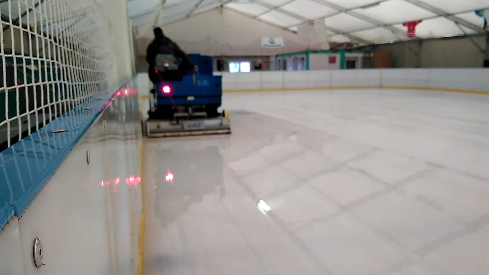 The freshly resurfaced ice of the Kőbányai WS Jégpálya under its tent roof — Kőbányai WS Jégpálya