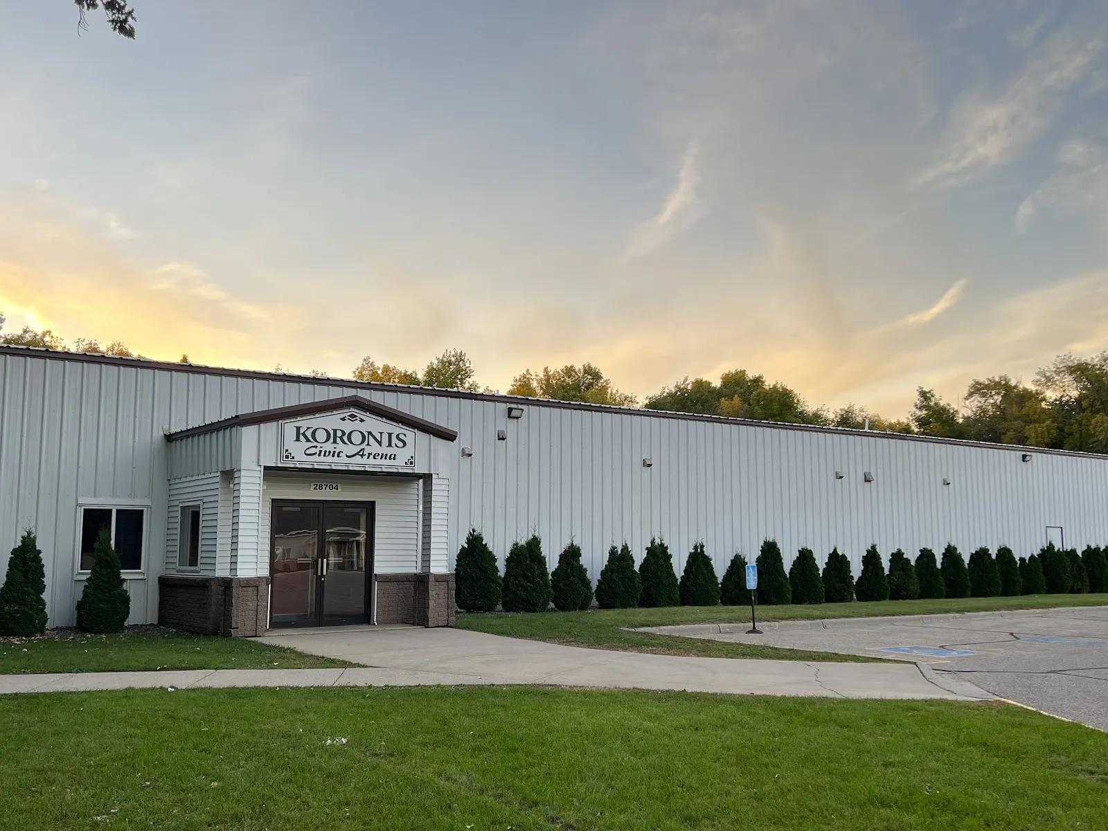 The Koronis Civic Arena building and entrance at dusk, 28704 Koronis Dr — Koronis Civic Arena