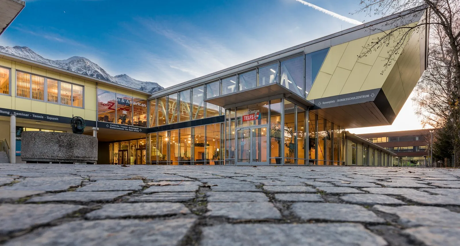 The entrance building of the SportZentrum Telfs, which houses the Kuppelarena — Kuppelarena Telfs (SportZentrum)