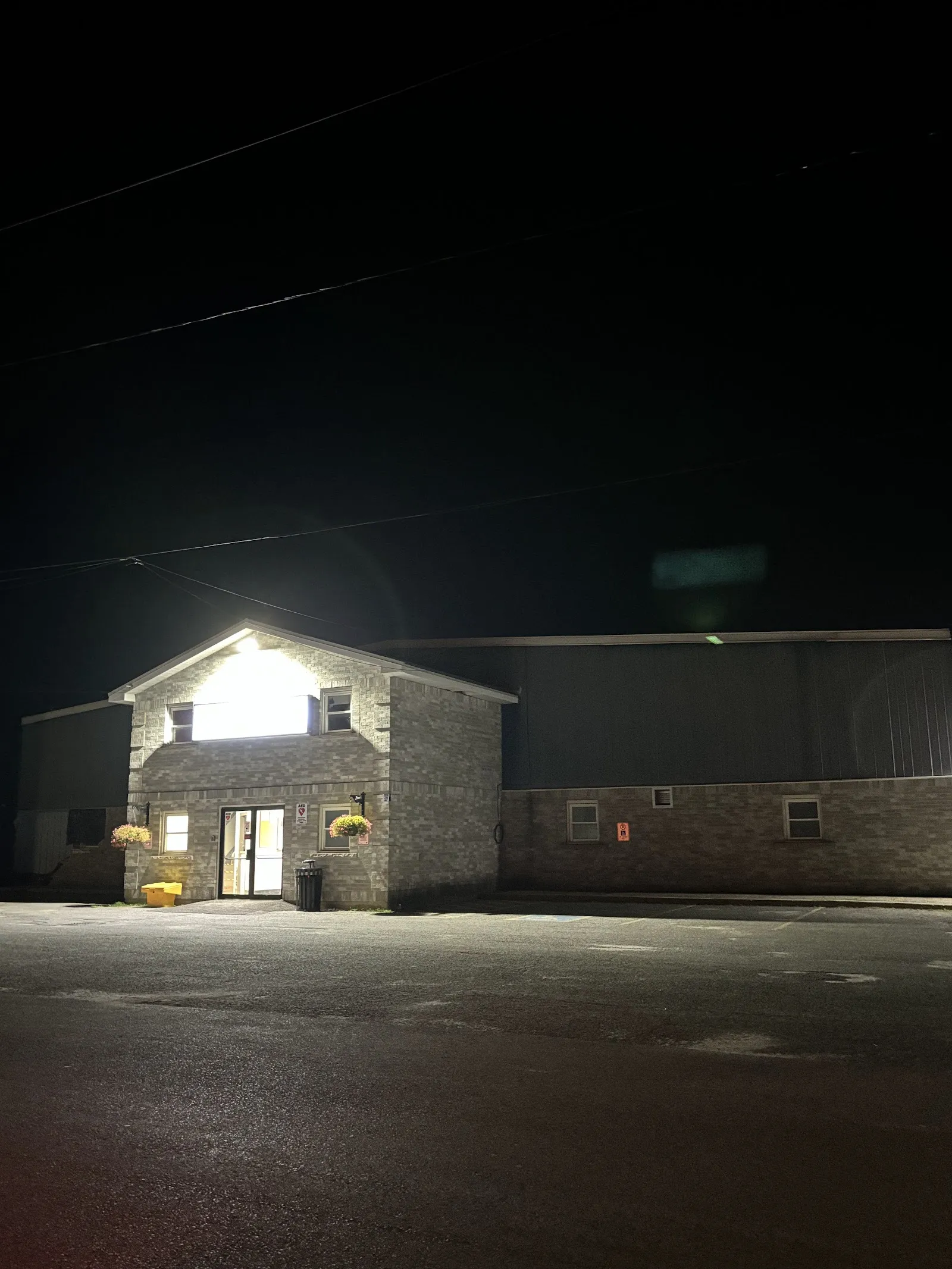 The stone-fronted entrance of the Lanark & District Community Centre lit at night — Lanark & District Community Centre