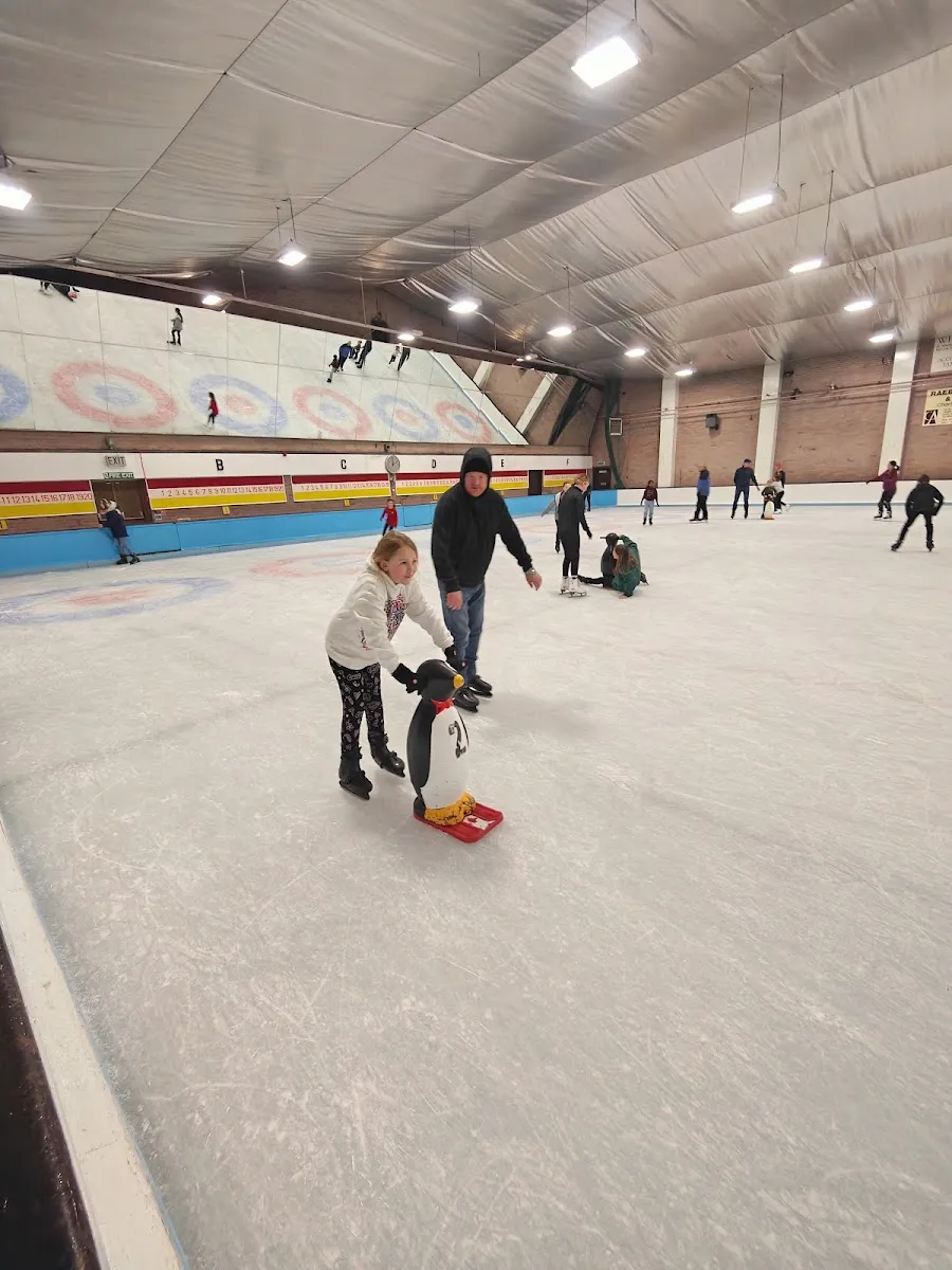A public skating session with a penguin skating aid on the rink's ice — Lanarkshire Ice Rink (Hamilton)