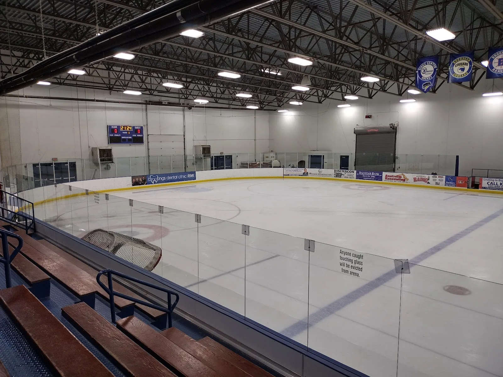The red rink at Larson Ice Center, one of its two main ice sheets, seen from the bleachers — Larson Ice Center