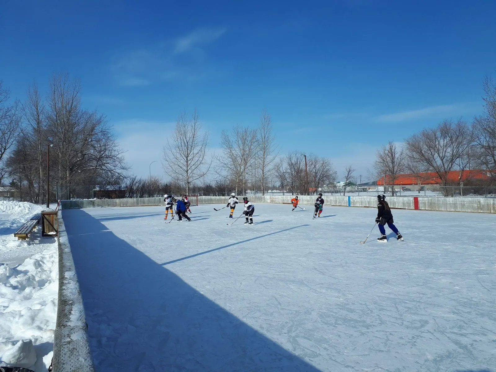 Players on the Leslie Park outdoor rink, Regina (Google Maps listing photo) — Leslie Park Outdoor Rink (Regina)