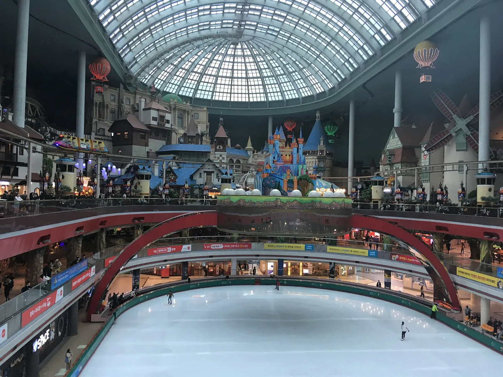 The Lotte World ice rink under the Adventure dome in 2018, before the 2021 renewal, with only a few skaters on the ice. — Lotte World Ice Rink