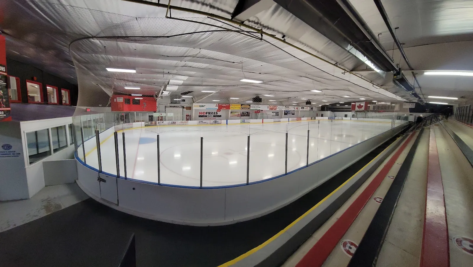 The empty ice surface at the Lou Jeffries Arena seen from along the boards — Lou Jeffries Arena