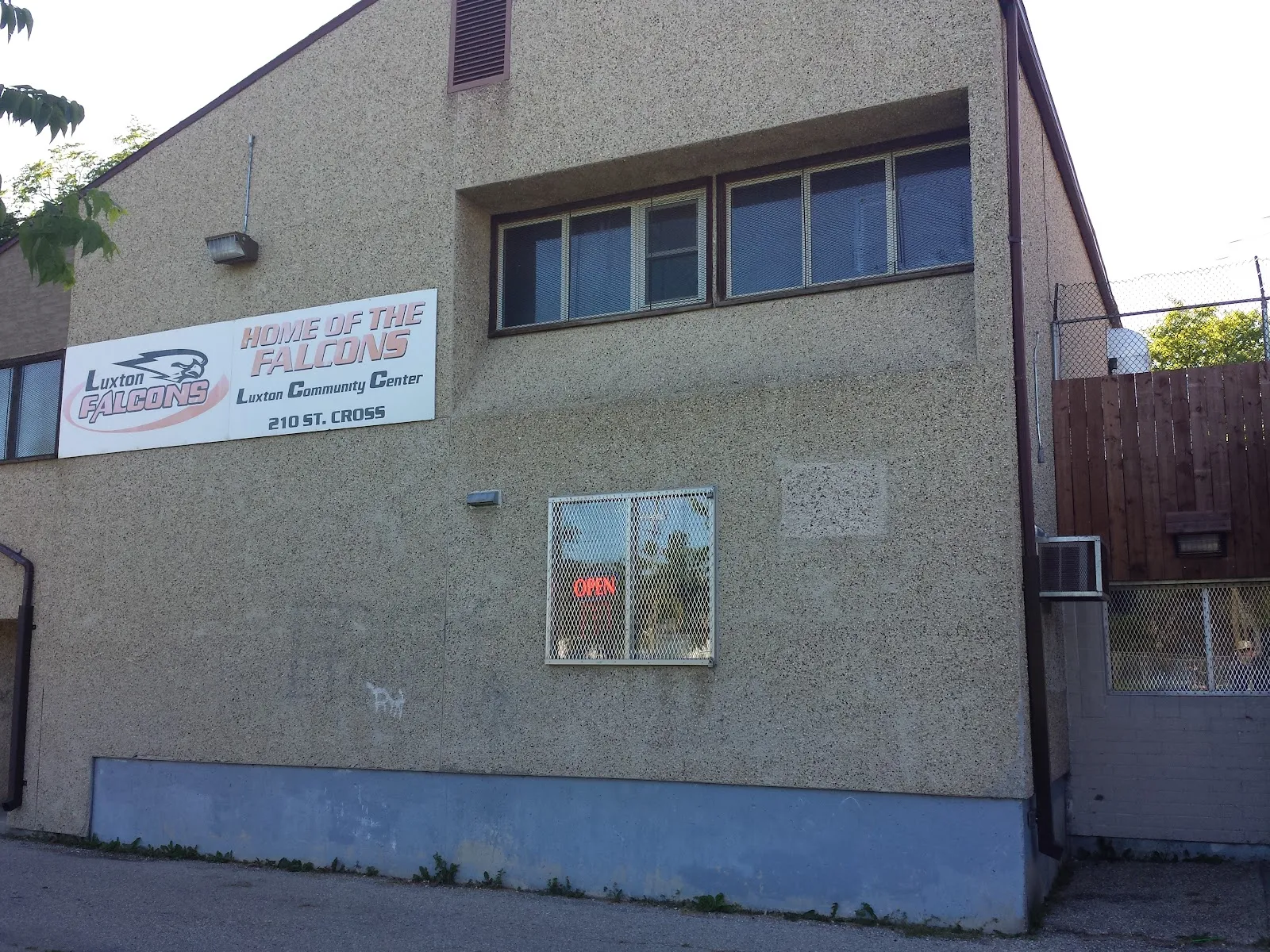 The Luxton Community Centre building with its sign on the wall — Luxton Community Centre Outdoor Rink