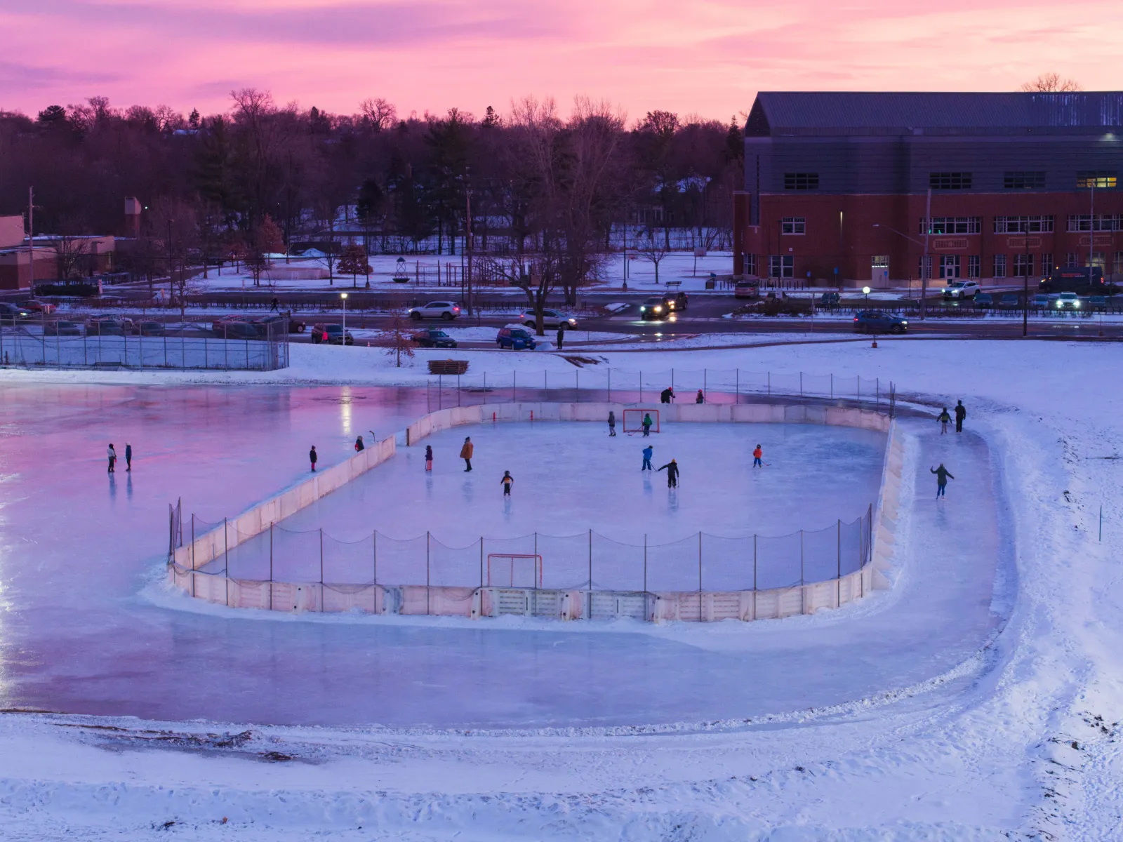 Skaters on the Lynnhurst Park outdoor rink, Minneapolis, at dusk (Minneapolis Park and Recreation Board) — Lynnhurst Park Outdoor Rink