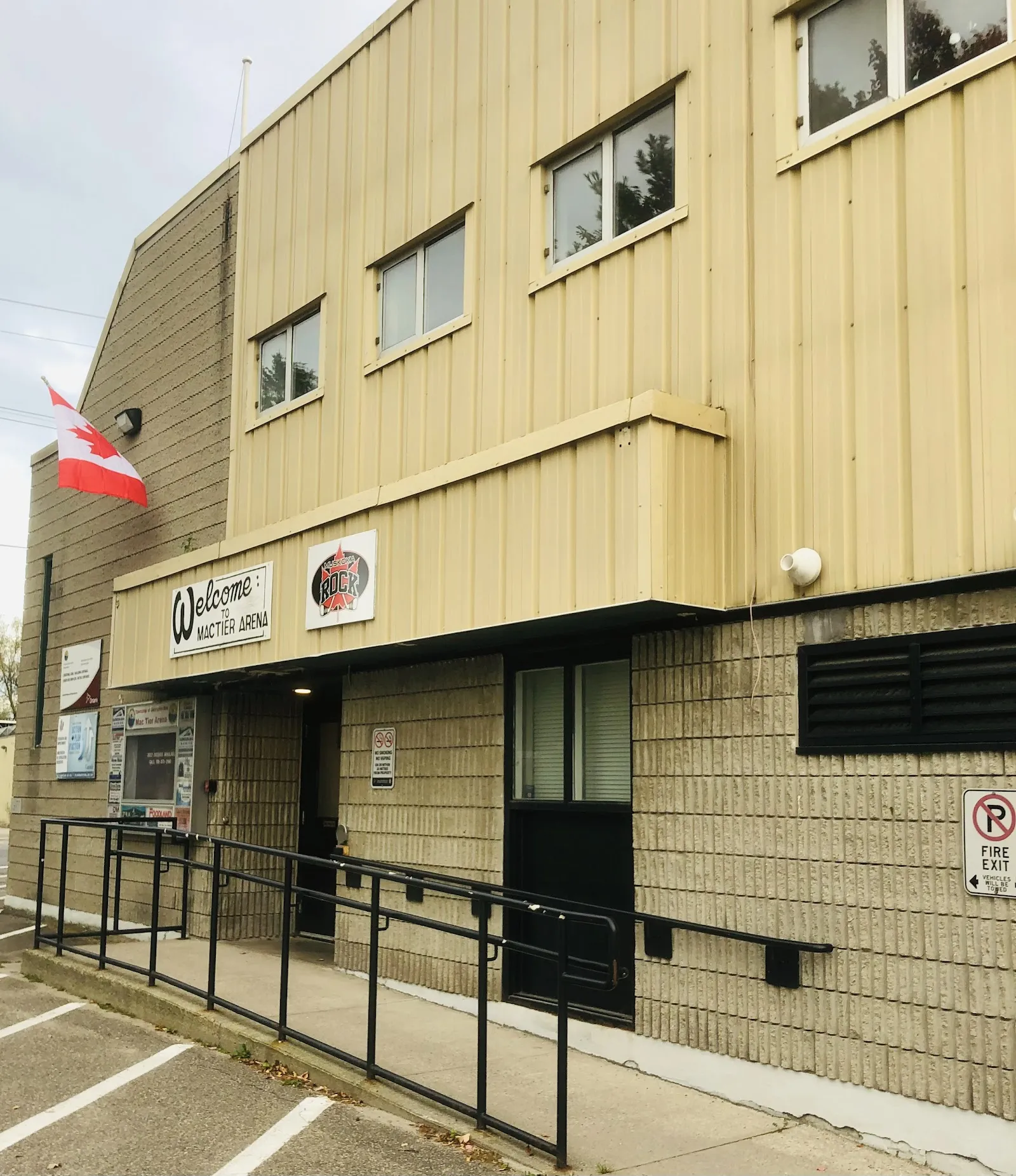 The ramp and entrance of the MacTier Arena, with its welcome sign — MacTier Memorial Arena