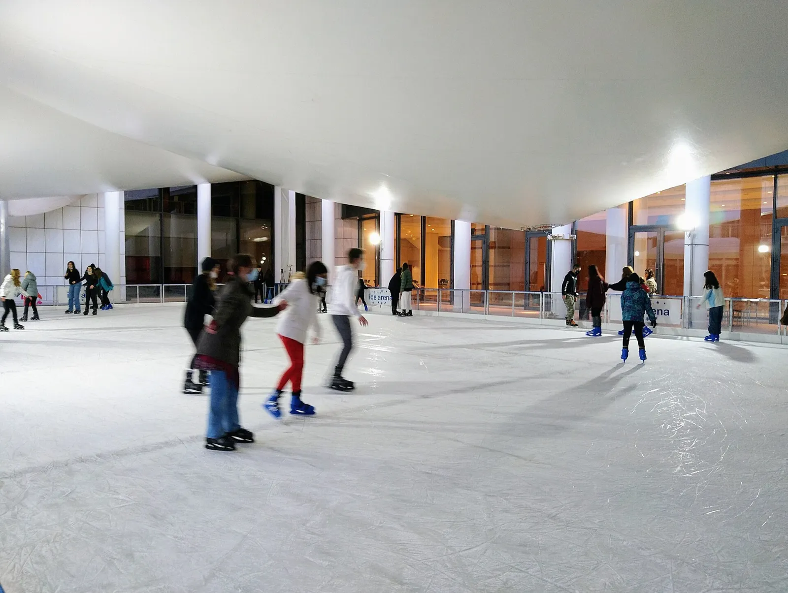 Skaters on the tent-covered ice of the Athens Concert Hall rink — Megaron Ice Rink (Athens Concert Hall)