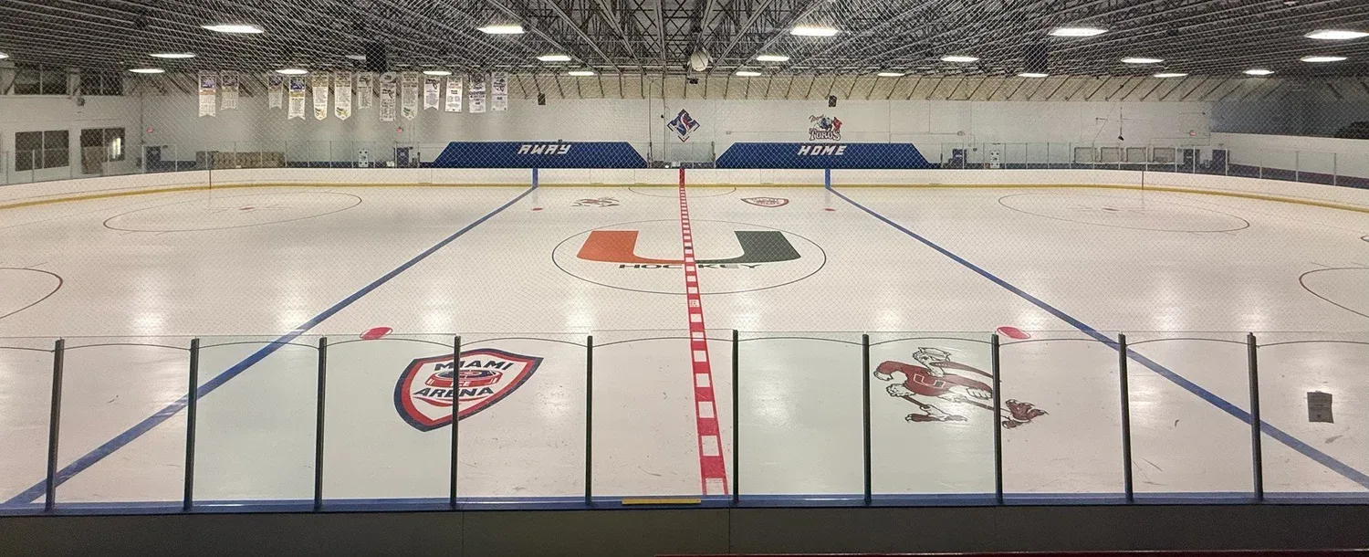 The second sheet from centre ice, benches and banners beyond — Miami Ice Arena (Kendall)