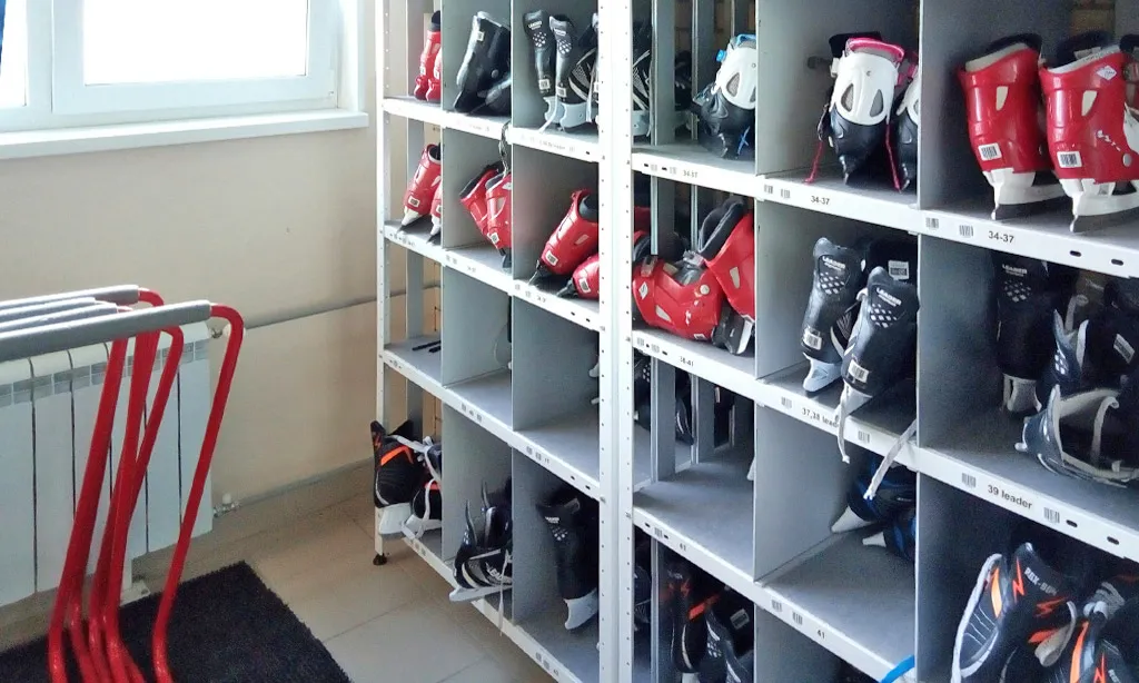 The skate-hire room at the Miassky Led rink, with the hire skates on their shelves — Miassky Led Ice Rink Miass