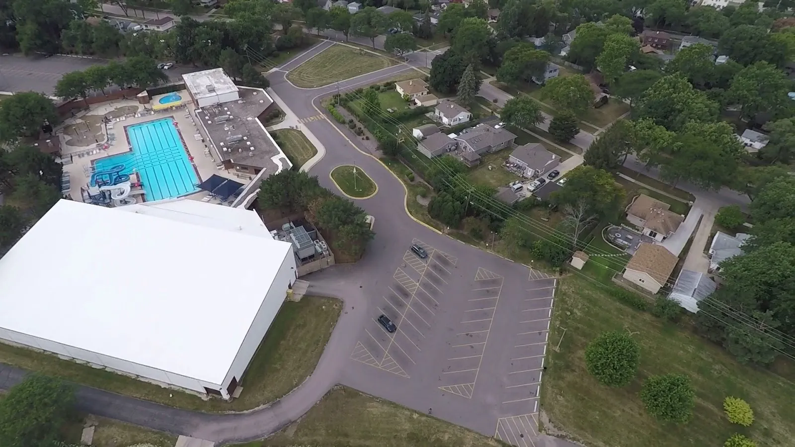 An aerial view of the Nelson Sports Complex in Rolling Meadows, with the white-roofed ice arena beside the outdoor pool — Nelson Sports Complex (Rolling Meadows)