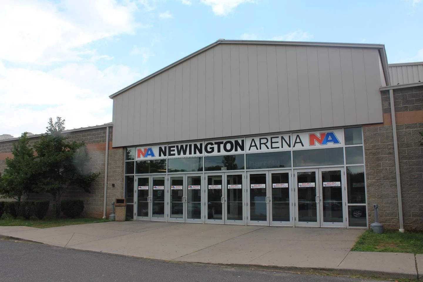 Newington Arena's glass entrance beneath the Newington Arena sign. — Newington Arena