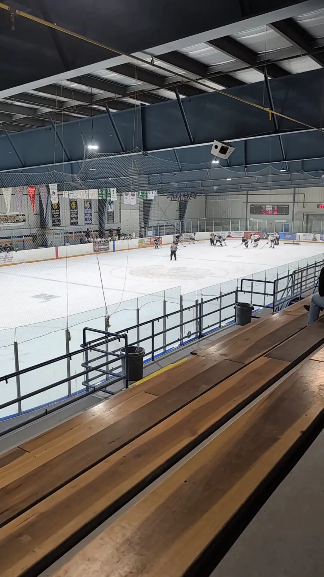 Players on the ice at the North Huron Wescast Community Complex, seen from the stands — North Huron Wescast Community Complex