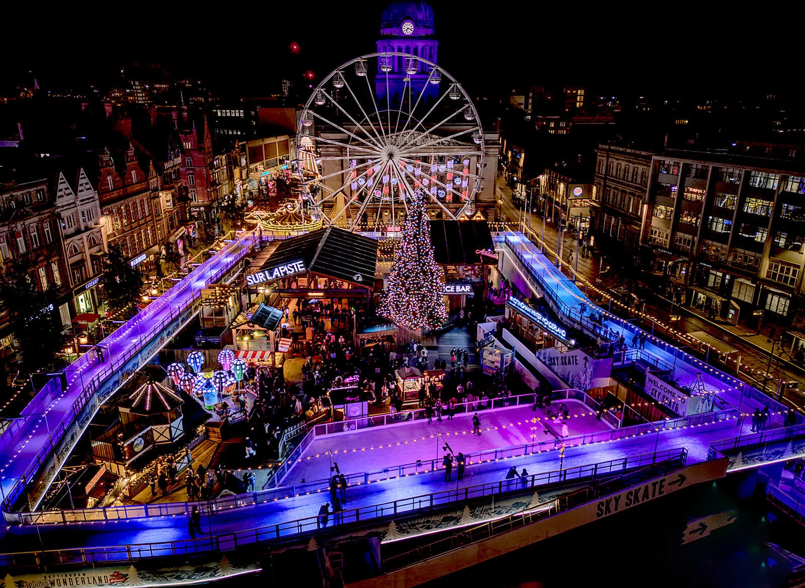 The ice rink and Sky Skate ice path around the Christmas market, seen from above — Nottingham Winter Wonderland Ice Rink and Sky Skate