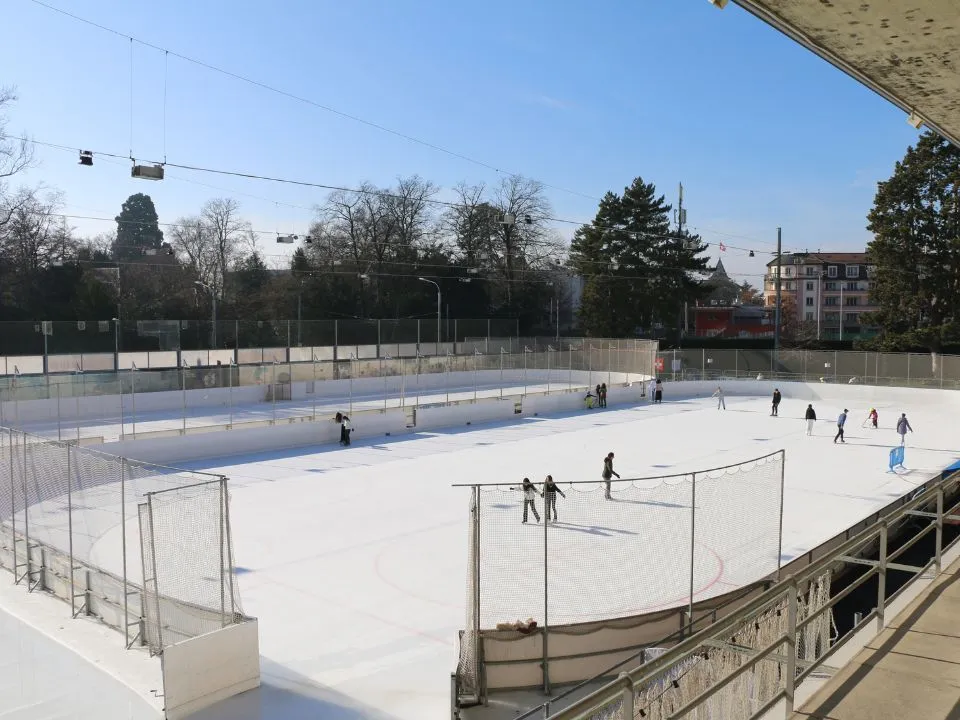 The open-air rinks of Montchoisi seen from outside the boards — Patinoire de Montchoisi