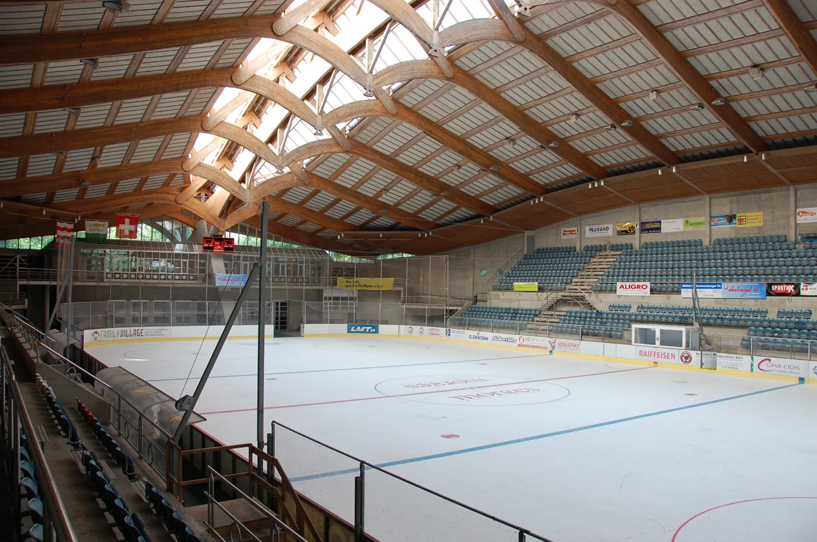 The ice of the Patinoire des Eaux-Minérales under its timber roof — Patinoire des Eaux-Minérales