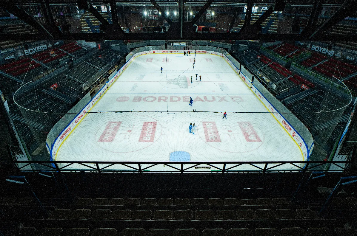 The ice surface of the Patinoire de Mériadeck seen from the stands — Patinoire de Mériadeck