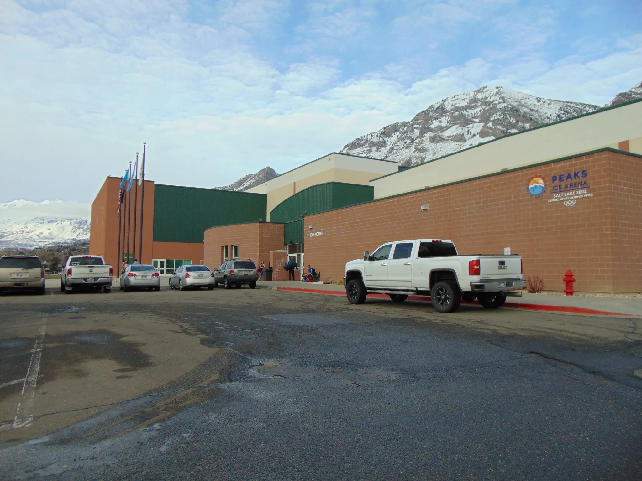 Peaks Ice Arena from its parking lot on a winter afternoon — Provo City Peaks Ice Arena