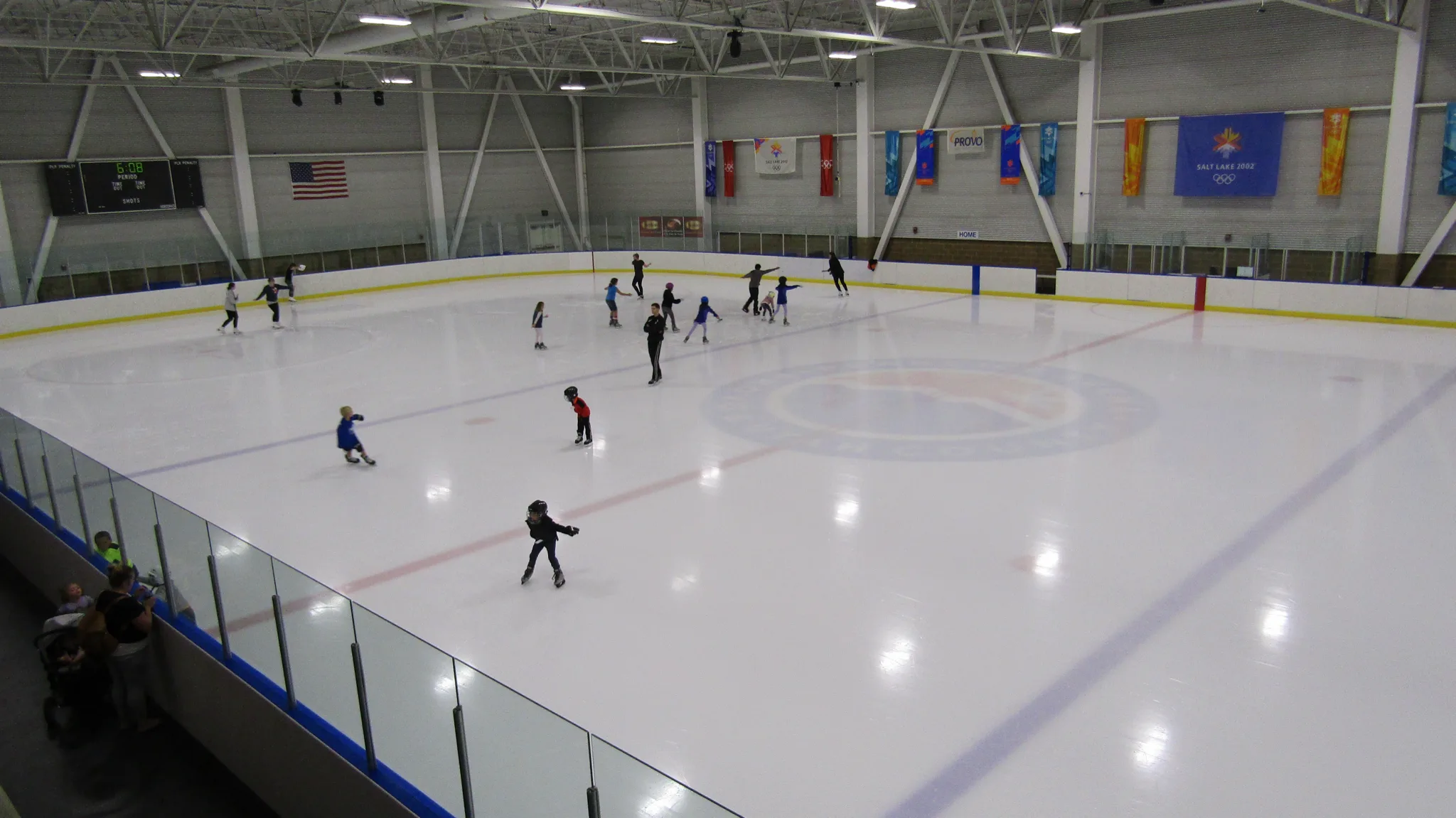 Nearly the whole ice sheet at Peaks Ice Arena seen from the spectator rail — Provo City Peaks Ice Arena