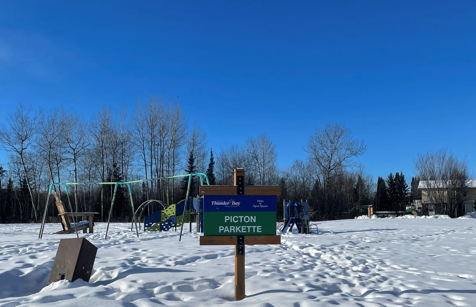 The Picton Parkette sign beside the play area — Picton Parkette Skating Pond
