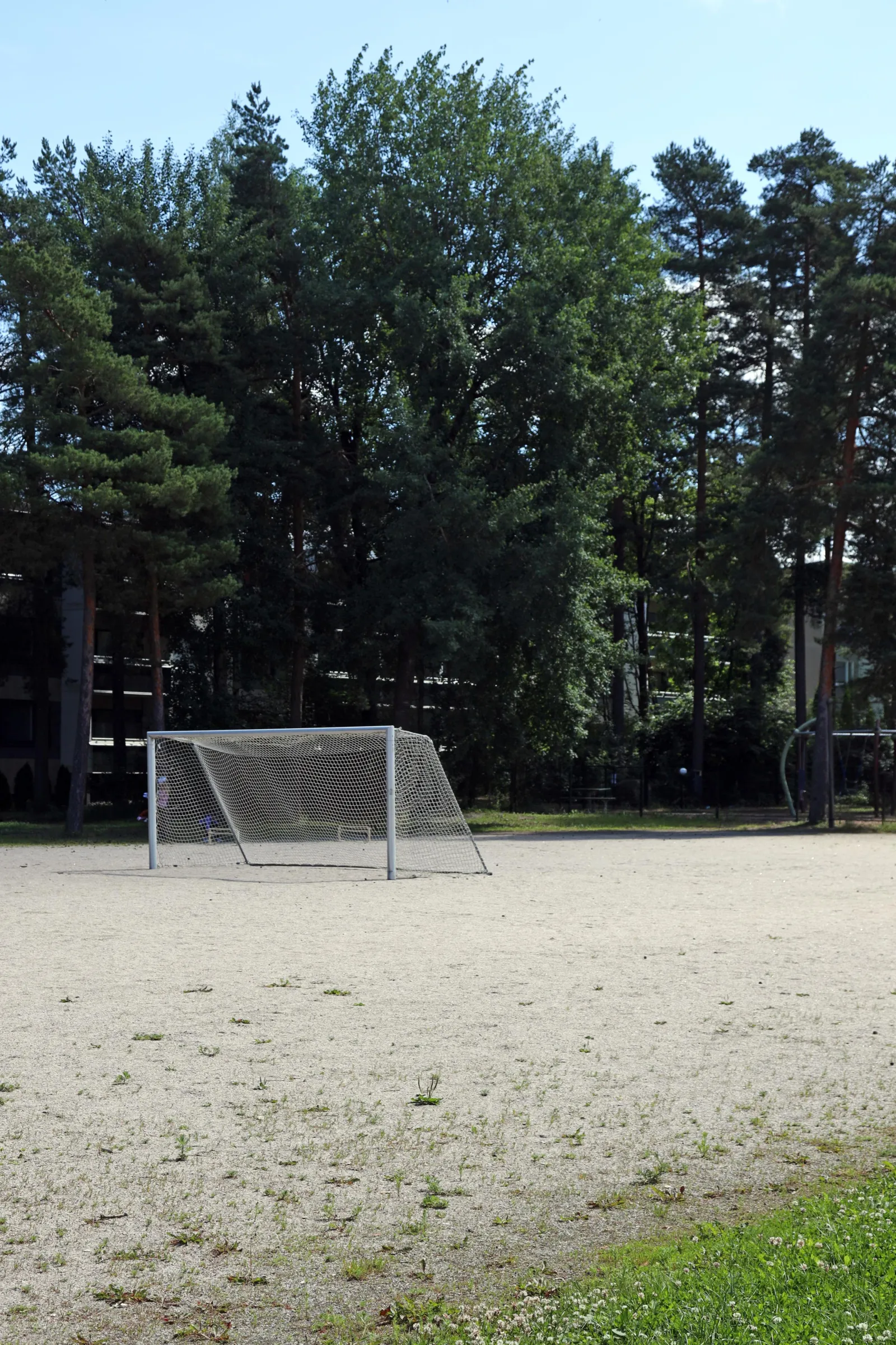The Piiparin field in summer, a ball field with a gravel (stone-dust) surface with goals; the City of Turku freezes its fields into skating fields in winter. — Piiparin luistelukenttä
