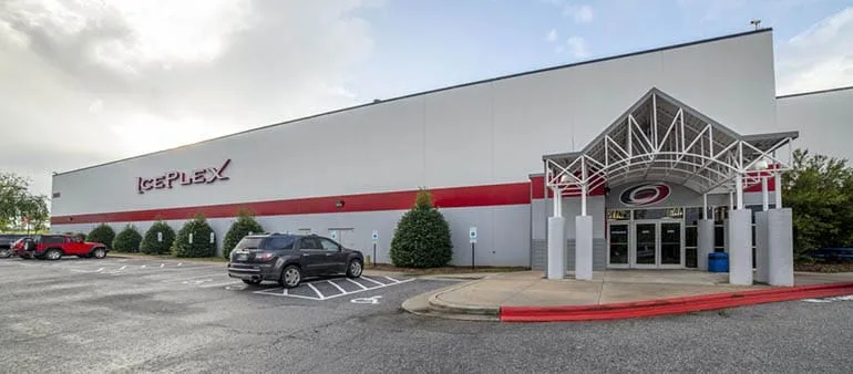 The IcePlex building with its Hurricanes-branded entrance canopy — Polar Ice Raleigh (Raleigh IcePlex)