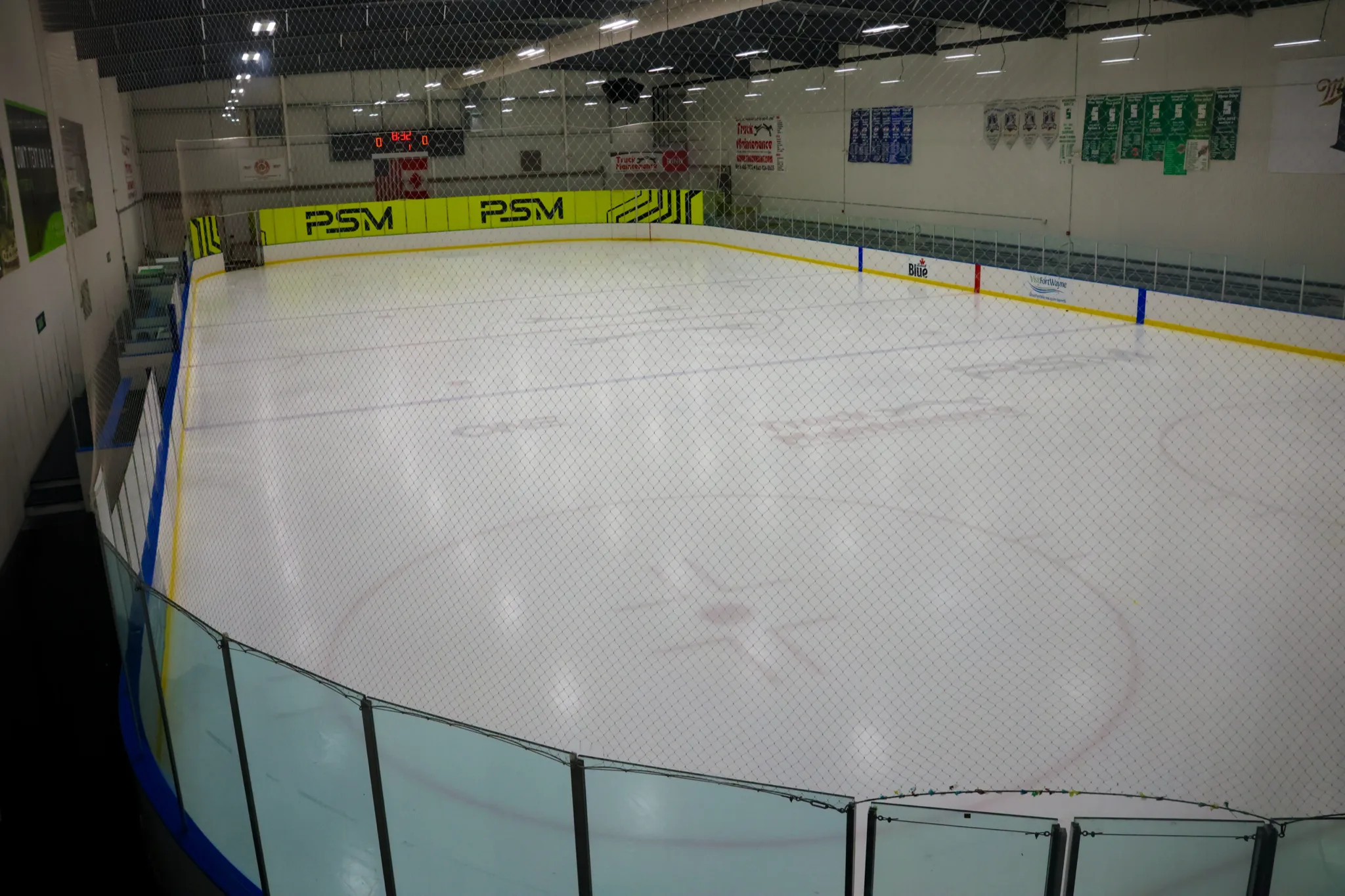 Empty sheet shot from the corner over the netting — SportONE Parkview Icehouse (PSM Icehouse)
