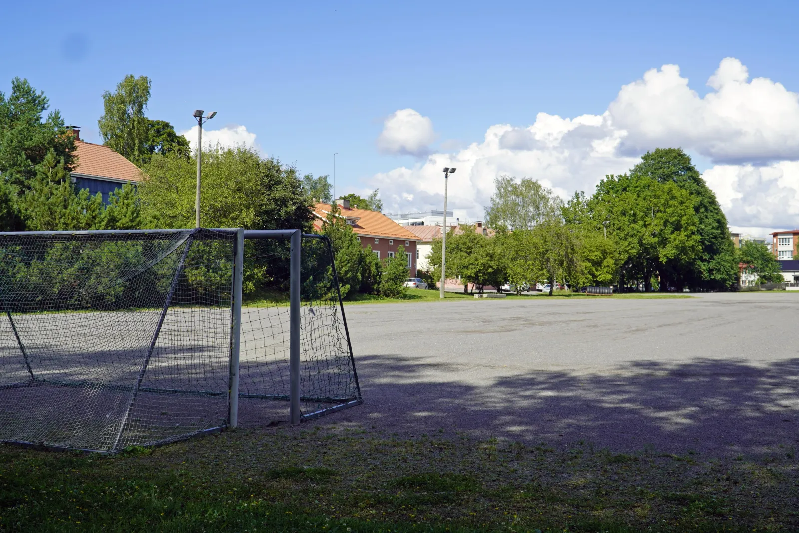 The Purokadun field in summer, a ball field with a gravel (stone-dust) surface with goals; the City of Turku freezes its fields into skating fields in winter. — Purokadun luistelukenttä