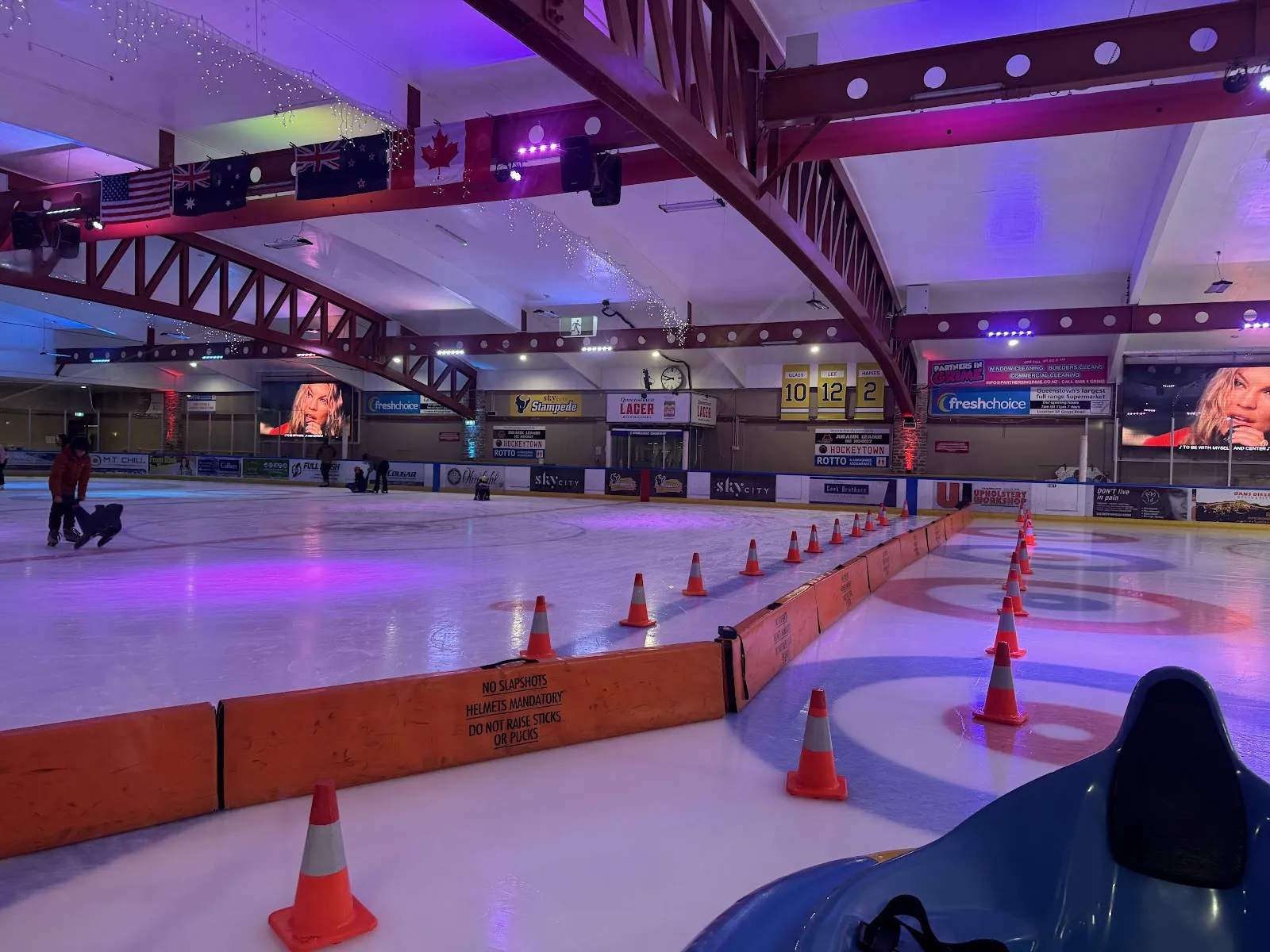 The ice at Queenstown Ice Arena under its roof trusses — Queenstown Ice Arena