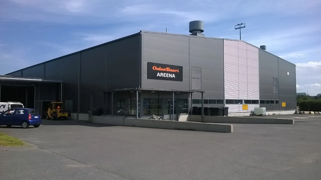 Raksilan harjoitusjäähalli seen from the parking area, with the OuluBaari Areena sign on the facade — Raksilan harjoitusjäähalli